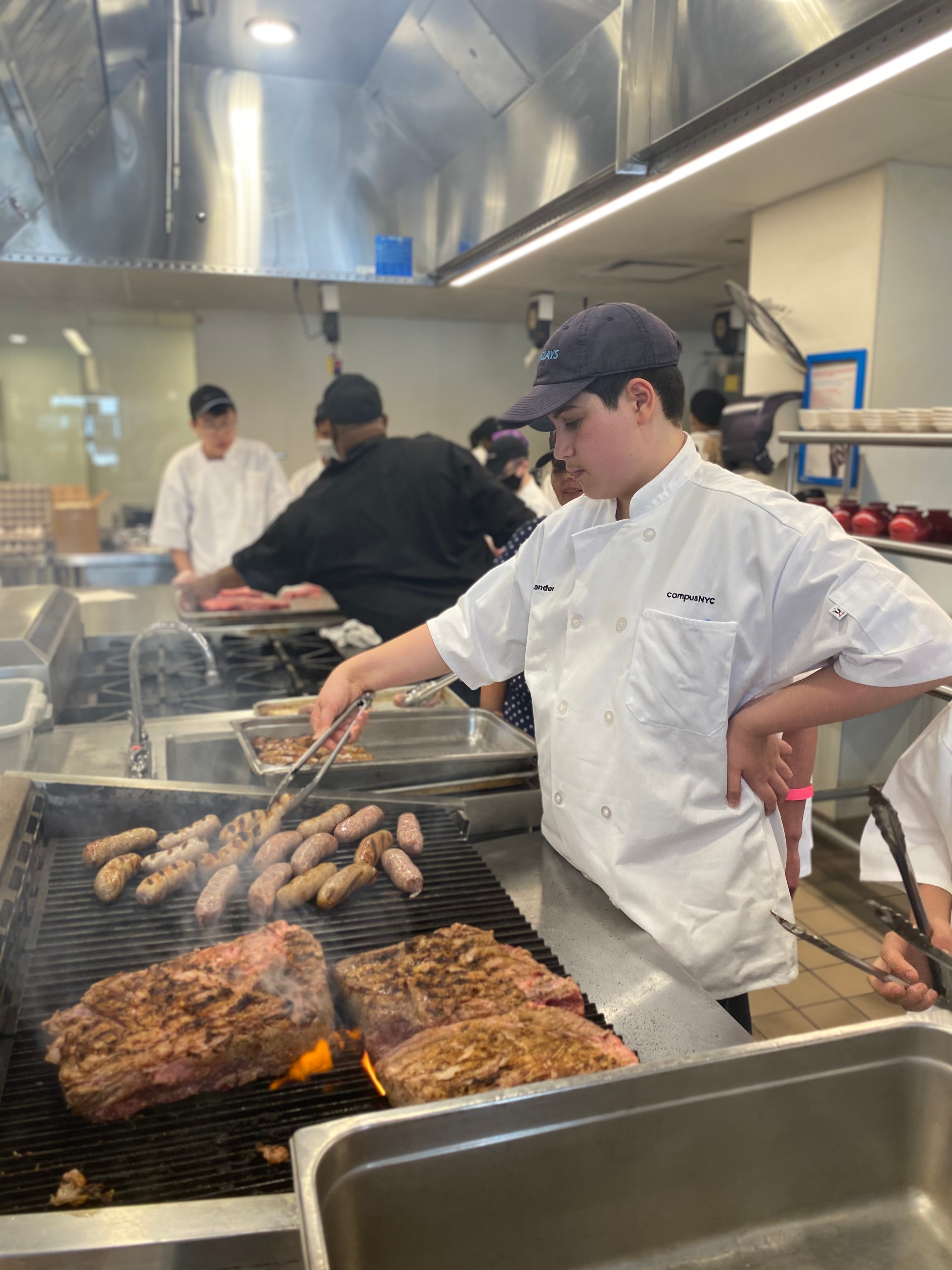 Camper cooking on the grill at Seattle Central College kitchen