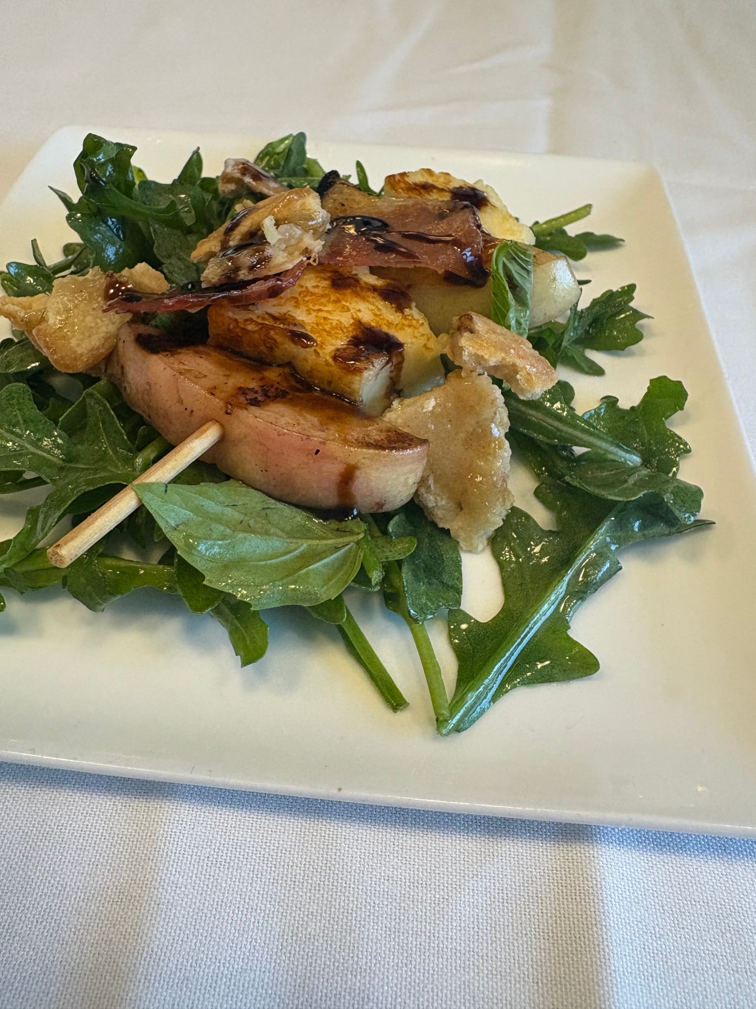 Grilled peach and arugula salad with prosciutto and balsamic